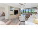 Open living room with large windows, comfortable seating, and plenty of space at 1651 Beach Rd # 311, Englewood, FL 34223