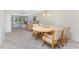 Open concept living and dining area with comfortable seating and natural light at 1651 Beach Rd # 311, Englewood, FL 34223