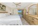 Inviting bedroom featuring neutral decor, plush bedding, and private access to the lanai at 1651 Beach Rd # 311, Englewood, FL 34223