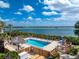 Inviting outdoor pool and sun deck area boasting breathtaking views of the bay at 1651 Beach Rd # 311, Englewood, FL 34223