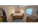 Well-lit bedroom boasts wood furnishings, a ceiling fan, and bright natural light at 171 Caddy Rd, Rotonda West, FL 33947