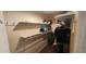 Walk-in closet with built-in shelving and hanging racks for organization at 171 Caddy Rd, Rotonda West, FL 33947