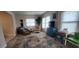 Comfortable seating area filled with natural light, perfect for relaxation and reading at 171 Caddy Rd, Rotonda West, FL 33947
