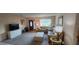 Cozy living room with plush seating, large windows, and a bright, airy atmosphere at 171 Caddy Rd, Rotonda West, FL 33947