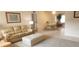 Cozy living room with comfortable seating, carpet, and view into the dining room at 171 Caddy Rd, Rotonda West, FL 33947