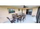 Covered patio area with comfortable seating, perfect for outdoor dining and relaxation at 171 Caddy Rd, Rotonda West, FL 33947