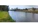 Scenic waterfront view of a canal lined with lush greenery and tropical foliage at 171 Caddy Rd, Rotonda West, FL 33947