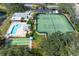 Aerial view of the pool, tennis court, and shuffleboard area at 202 Silver Lake Dr # 203, Venice, FL 34292