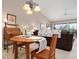 Comfortable dining space adjacent to a sunlit living room, perfect for entertaining at 202 Silver Lake Dr # 203, Venice, FL 34292