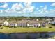 Beautiful multi-unit condo with screened lanais overlooking a tranquil waterfront and tropical landscaping at 202 Silver Lake Dr # 203, Venice, FL 34292