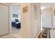 Inviting hallway with tile flooring, closet space, and artwork at 202 Silver Lake Dr # 203, Venice, FL 34292