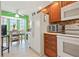Bright kitchen with wooden cabinets, modern appliances, a breakfast nook and lots of natural light at 202 Silver Lake Dr # 203, Venice, FL 34292