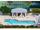 Inviting community pool area with comfortable lounge chairs and a charming gazebo for relaxation at 202 Silver Lake Dr # 203, Venice, FL 34292