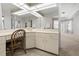 Bright bathroom vanity area features a large mirror and ample counter space at 217 Rockwood Way, Englewood, FL 34223