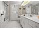 Neat bathroom featuring ample counter space and a shower-tub combo at 217 Rockwood Way, Englewood, FL 34223