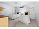 Light and airy bedroom with two twin beds, beach house decor, and ample natural light at 217 Rockwood Way, Englewood, FL 34223