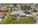 Exterior view of the home with well-manicured lawn, landscaping, and neutral exterior at 217 Rockwood Way, Englewood, FL 34223