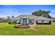 Charming one-story home with a well-maintained lawn and beautiful landscaping at 217 Rockwood Way, Englewood, FL 34223