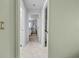 Hallway view to bright primary bedroom at 217 Rockwood Way, Englewood, FL 34223