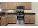 Kitchen with stainless steel oven and microwave, and ample counter space at 217 Rockwood Way, Englewood, FL 34223