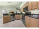 Spacious kitchen with stainless steel appliances and plenty of cabinet space at 217 Rockwood Way, Englewood, FL 34223