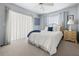 Inviting main bedroom with large window, soft lighting, and decorative touches at 217 Rockwood Way, Englewood, FL 34223