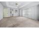 Bright and spacious main bedroom with large windows, neutral walls, and a walk-in closet at 217 Rockwood Way, Englewood, FL 34223