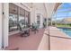 Charming screened patio with outdoor seating and access to the pool area at 217 Rockwood Way, Englewood, FL 34223