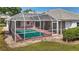 Screened-in pool offers a private outdoor retreat for relaxation and entertainment at 217 Rockwood Way, Englewood, FL 34223
