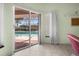 View of the pool and lanai area from inside the home's living space at 217 Rockwood Way, Englewood, FL 34223