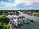 Beautiful waterfront featuring boats docked along the canal, complemented by lush green landscapes at 217 Rockwood Way, Englewood, FL 34223