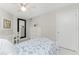 Inviting bedroom featuring coastal decor, white furniture, and ample natural light, perfect for a relaxing getaway at 2380 N Beach Rd # 108, Englewood, FL 34223