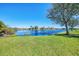 Picturesque backyard overlooking a beautiful pond, providing a serene and private outdoor space at 2625 Wax Myrtle, Port Charlotte, FL 33953