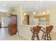 Open kitchen with wooden cabinetry and a breakfast bar at 2625 Wax Myrtle, Port Charlotte, FL 33953