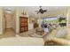 Bright living room with stylish furnishings, tile floors, ceiling fan, and access to an outdoor living space at 2625 Wax Myrtle, Port Charlotte, FL 33953