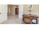 Office area features a wooden desk and chair, tile flooring visible through the doorway, and natural light at 2625 Wax Myrtle, Port Charlotte, FL 33953