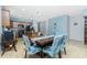 Dining area features a modern table with bench seating and kitchen access at 2628 Sherman Oak Dr, North Port, FL 34289