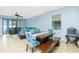 Dining area features a modern table with bench seating and access to the patio at 2628 Sherman Oak Dr, North Port, FL 34289