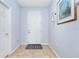 Bright foyer with tile flooring, neutral wall color, and white doors at 2628 Sherman Oak Dr, North Port, FL 34289