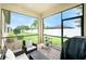 Inviting outdoor patio with comfortable seating, brick flooring, and a serene backyard view at 2628 Sherman Oak Dr, North Port, FL 34289