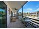 Enjoy outdoor living on this screened balcony with seating, fan, and courtyard views at 2727 N Beach Rd # 113, Englewood, FL 34223