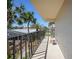 Relaxing balcony area with shade, fresh air and palm tree views at 2727 N Beach Rd # 113, Englewood, FL 34223