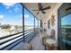 Cozy screened balcony featuring comfortable seating and beautiful waterfront views for relaxing at 2727 N Beach Rd # 113, Englewood, FL 34223