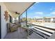 This screened balcony offers views of the surrounding complex and community pool at 2727 N Beach Rd # 113, Englewood, FL 34223