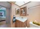 Well-lit bathroom features a vanity with storage and modern fixtures at 2727 N Beach Rd # 113, Englewood, FL 34223