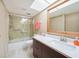 Bathroom featuring a modern vanity with sleek dark wood drawers and framed shower at 2727 N Beach Rd # 113, Englewood, FL 34223