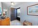 Bright entryway with tile floors, and a storm door providing natural light and ventilation at 2727 N Beach Rd # 113, Englewood, FL 34223
