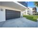 Ground level garage and front yard area at 2727 N Beach Rd # 113, Englewood, FL 34223