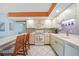 Well-lit kitchen boasts sleek appliances and ample counter space, perfect for culinary enthusiasts at 2727 N Beach Rd # 113, Englewood, FL 34223