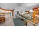 Open-concept living room and kitchen featuring tile floors and comfortable seating at 2727 N Beach Rd # 113, Englewood, FL 34223